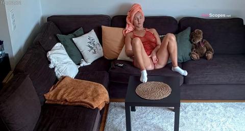 Reallifecam - Leora relaxes on the couch after taking a bath and stroking her pussy 12.11.2021