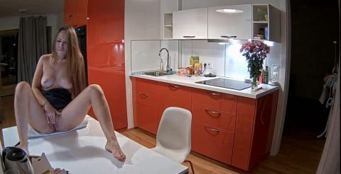 Reallifecam -Leora masturbates for her boyfriend through a video call sitting on the kitchen table 2